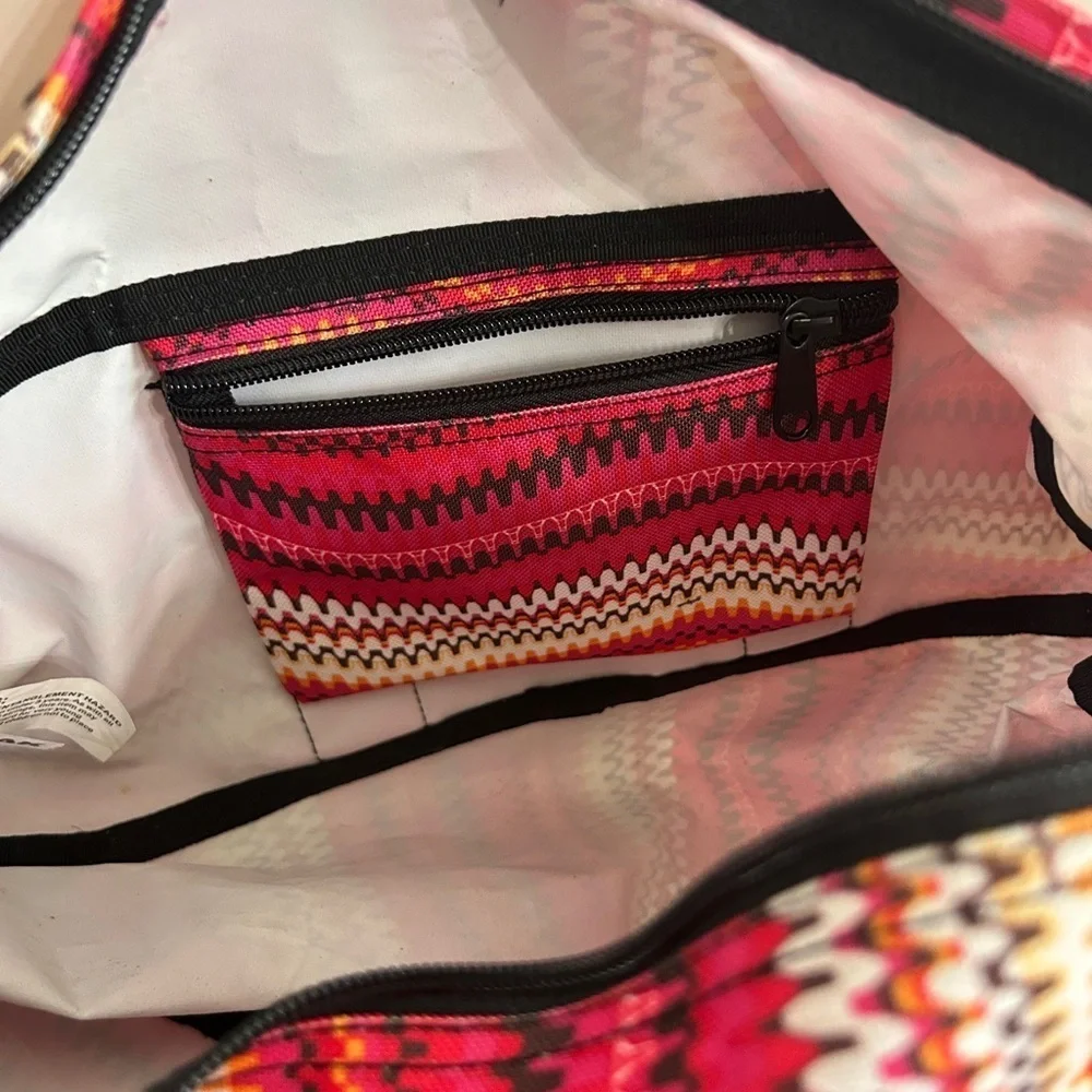 Like new YakPak duffle bag. Pink colorful zigzag design with black details